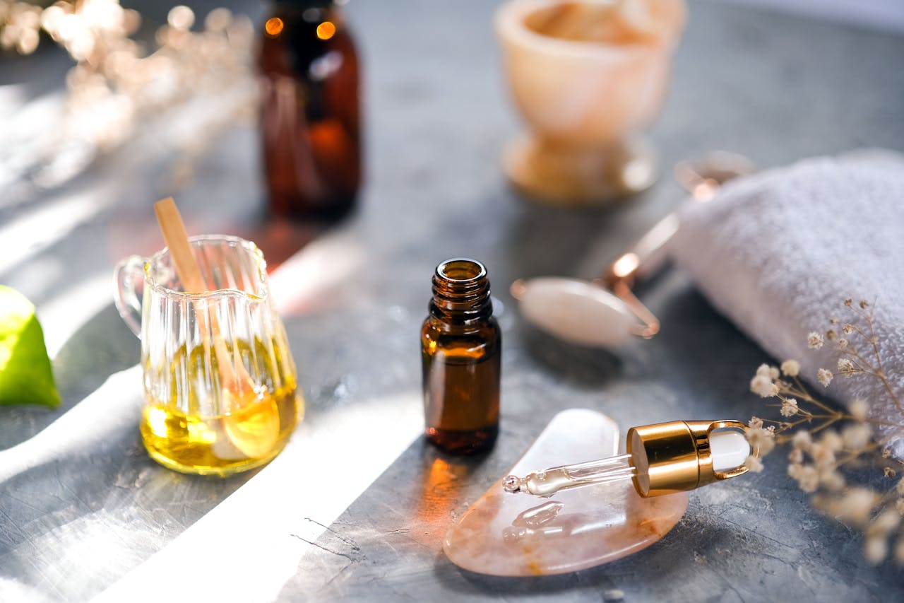 services-03 Aromatic oils and spa tools arranged on a table, perfect for relaxation.